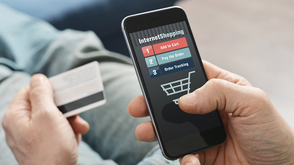 8 Reasons why your E-commerce business needs a great affiliate network. A person holds a credit card and uses a smartphone to shop online, with options to add to cart, pay, and track an order visible on the screen.